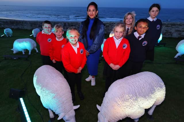 Deepa Mann-Kler with children from Seahouses Primary School who will adopt a sheep for the Art Trail (photo: Raoul Dixon)