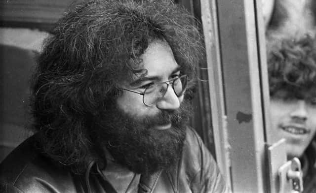 Lead guitarist for American rock band the "Grateful Dead" Jerry Garcia, chats to fans backstage after the group's marathon session at Bickershaw Festival in 1972.