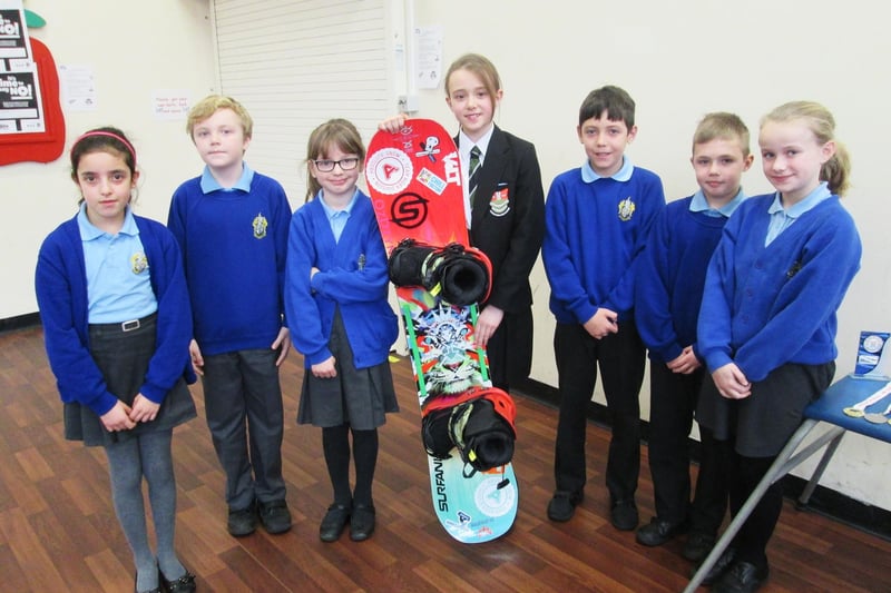 Nicole Haines, an international snowboarder from Leigh pictured with pupils from St Thomas’s