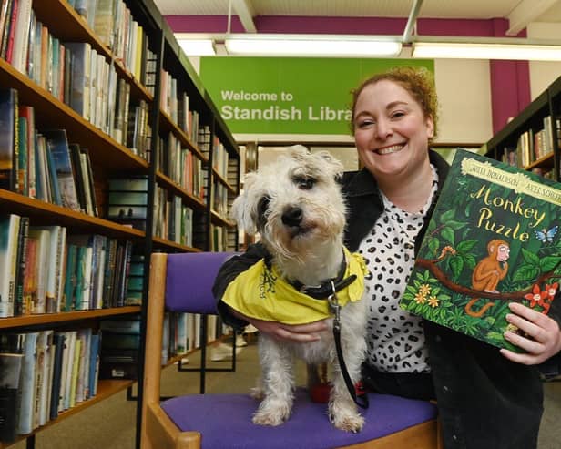 Kathryn Lees and her reading dog Cliff hold a session in Standish Library during half-term.