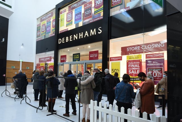 Shoppers queue outside Debenhams in April 2021 as the store reopens after the coronavirus lockdown