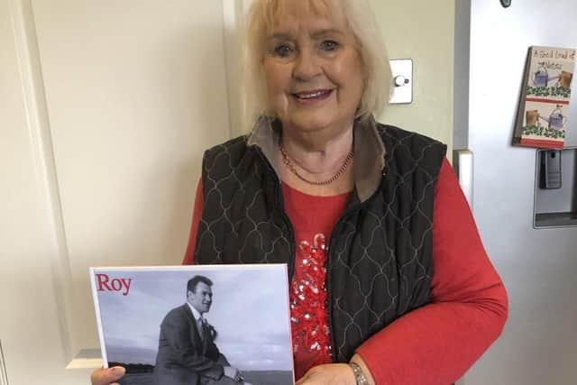 Carolyn Evans with the book of her late husband Roy donated to her by the Wigan Rugby Heritage Society