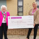 Wigan Rotary president Monica Meehan hands over the cheque for Wigan and Leigh Hospice