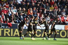 Will Keane accepts the congratulations of his team-mates after opening the scoring