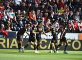 Will Keane accepts the congratulations of his team-mates after opening the scoring