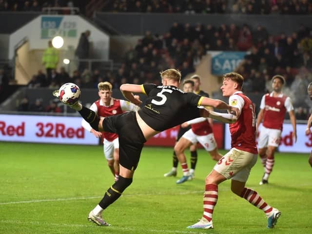 Jack Whatmough gets stuck in during a scrappy game against Bristol City