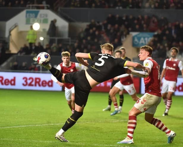Jack Whatmough gets stuck in during a scrappy game against Bristol City