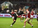 Jack Whatmough gets stuck in during a scrappy game against Bristol City