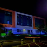 Leigh Infirmary illuminated in blue in celebration of the NHS's 75th anniversary