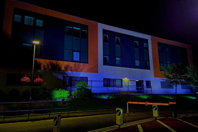 Leigh Infirmary illuminated in blue in celebration of the NHS's 75th anniversary