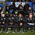 Kolo Toure with his new backroom staff on their first outing at the DW Stadium