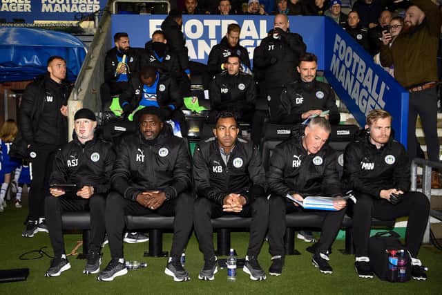 Kolo Toure with his new backroom staff on their first outing at the DW Stadium
