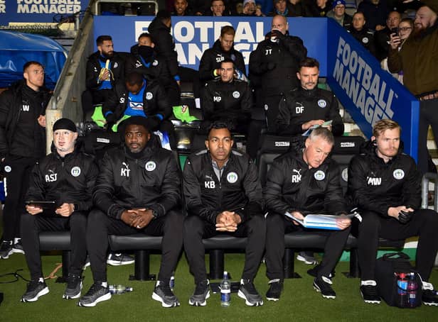 Kolo Toure with his new backroom staff on their first outing at the DW Stadium