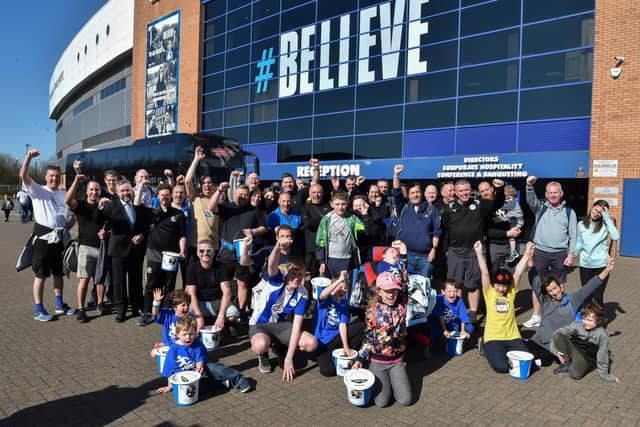 The Joseph's Goal walkers celebrate reaching the DW Stadium