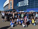 The Joseph's Goal walkers celebrate reaching the DW Stadium