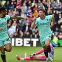 Charlie Hughes' late effort saw Latics record a 2-1 win at Lincoln City