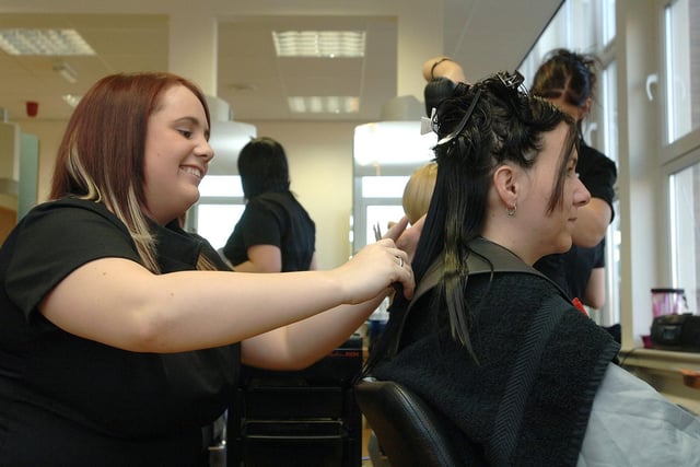 Nicola Heyes has her hair trimmed by NVQ level two hairdressing student Alana Shaw at the Image Centre at Wigan and Leigh College