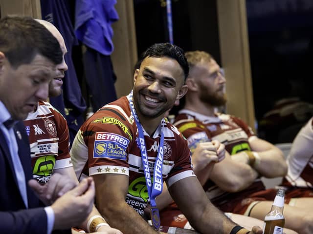 Wigan's Bevan French celebrates in the changing room after victory over Hull KR