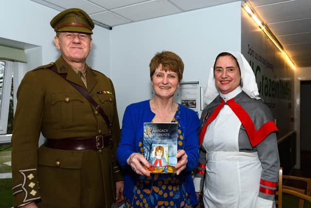 Author Rhona Whiteford with Major Alan Taberner and Major Linda Taberner from the Medical Living History Group with her new book A Legacy of Ghosts
