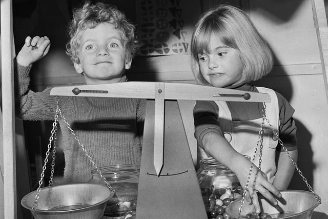 Weighing things up are Mark Osborne and Susan Lee at Woodfield Infants School on Wigan Lane in October 1971.