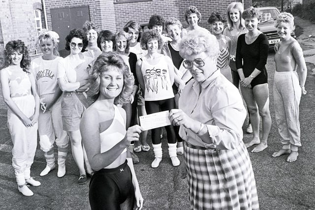 Retro 1987 - St Wilfrid's Church Standish ladies aerobics class present a cheque to a local charity.