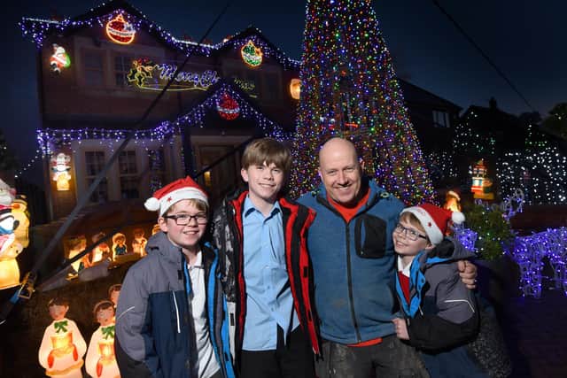 Paul Molyneux with sons Alfie, Ethan and Theo after switching on their lights in 2019