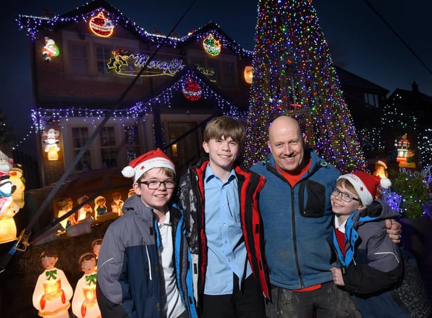 Paul Molyneux with sons Alfie, Ethan and Theo after switching on their lights in 2019