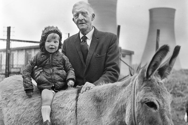 A donkey ride for 2 year old Stephen Smith with grandad at the midsummer fair at Comet Youth Club, Poolstock, on Saturday 24th of June 1972.