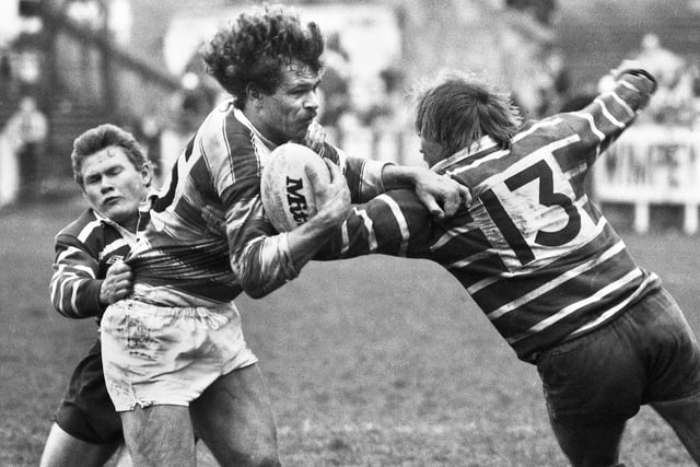 Wigan forward Nick Du Toit battling through against Featherstone Rovers in a league match at Central Park on Sunday 21st of April 1985. Wigan won the match 12-10.