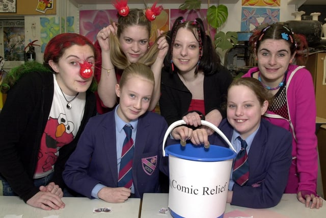RED NOSE DAY 2003 - Deanery High School Sixth Form students Julia Howard, left, Steff Downey, Emma Wilkinson and Stephanie Jones, complete with their funky hair styles collect money for Comic Relief from Emma Pennington and Katie Aidley.