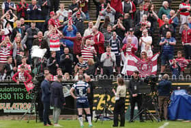 Wigan fans celebrate following the victory over Castleford Tigers