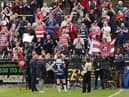 Wigan fans celebrate following the victory over Castleford Tigers