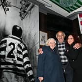 Billy Boston with wife Joan, left, and grandaughter Lauren Boston, right