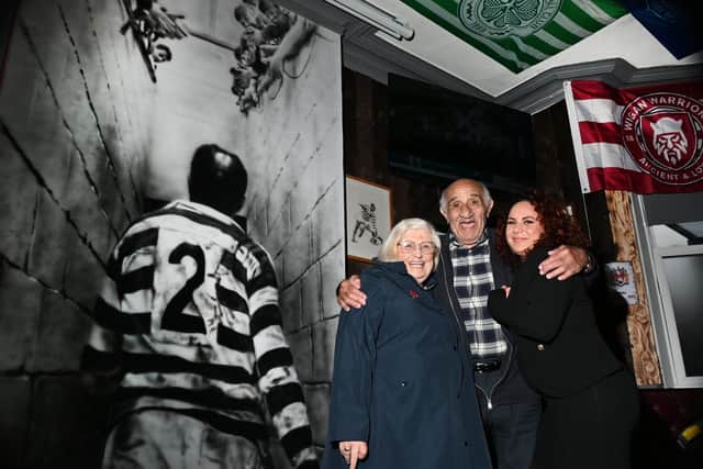 Billy Boston with wife Joan, left, and grandaughter Lauren Boston, right
