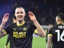 Will Keane celebrates his last-gasp leveller at Cardiff