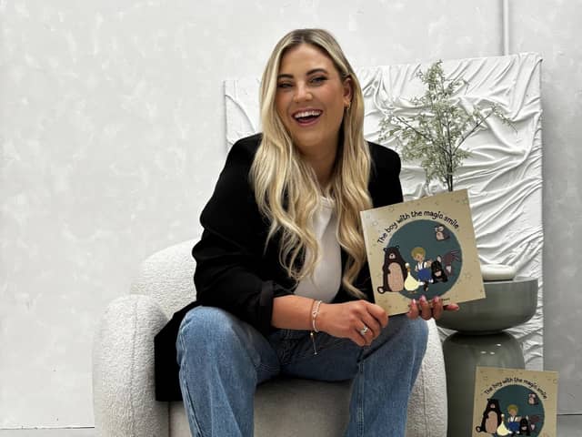 Gemma with her book The Boy with the Magic Smile