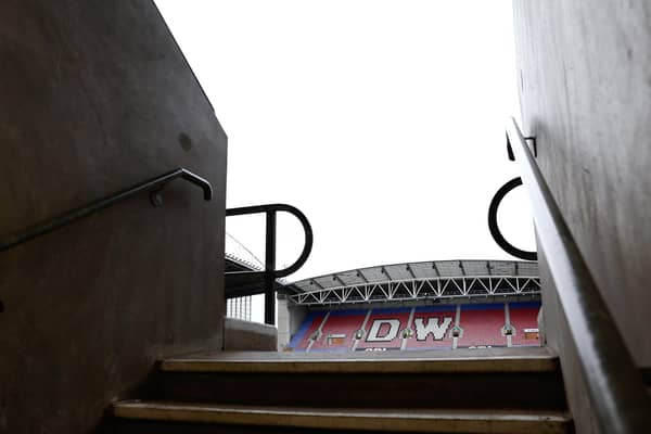 Wigan Athletic play their home games at the DW Stadium.