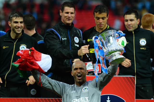 Mike Pollitt (top middle) in the thick of the FA Cup-winning celebrations