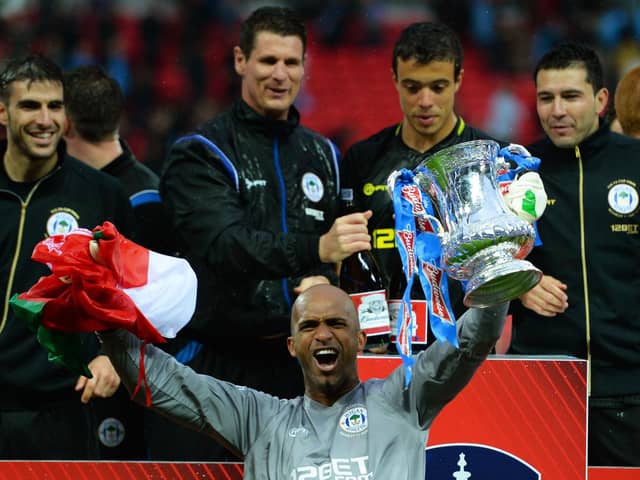 Mike Pollitt (top middle) in the thick of the FA Cup-winning celebrations