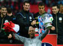 Mike Pollitt (top middle) in the thick of the FA Cup-winning celebrations