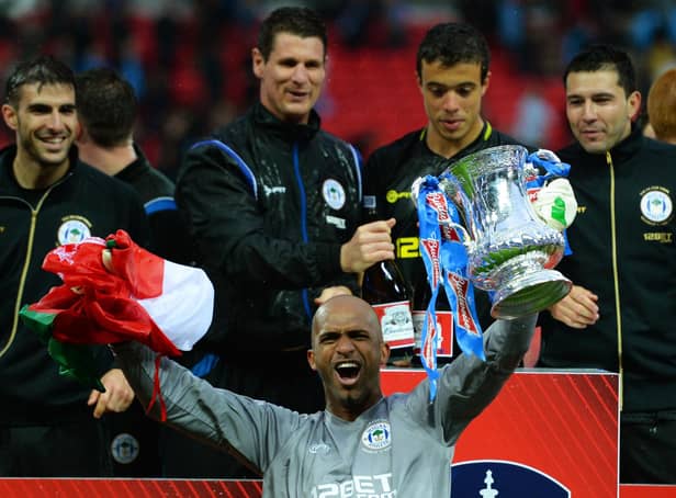 Mike Pollitt (top middle) in the thick of the FA Cup-winning celebrations