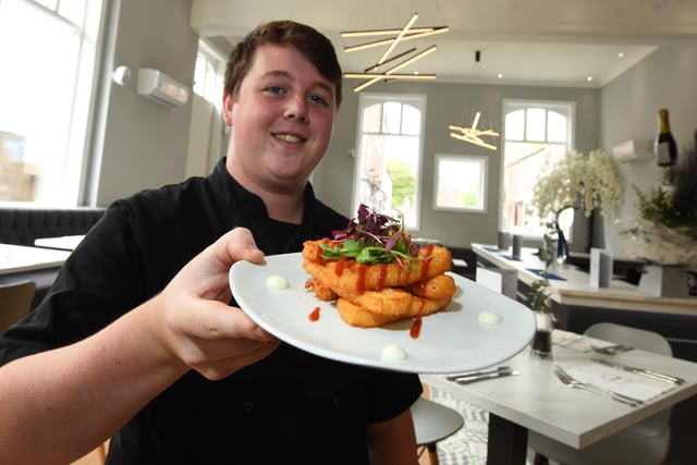 Chef Callum Broxson with one of the small plates on the menu.