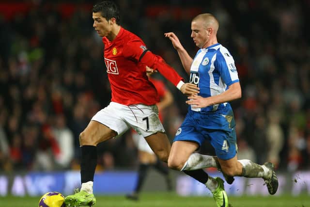 Lee Cattermole in action for Latics against Manchester United