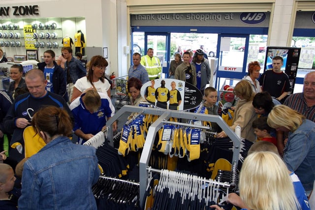 Premiership Wigan Athletic launched their new AWAY yellow kit at The JJB Store in Robin Park.  Fans flock to get their new kit and autographs.