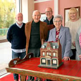 Pictured with the model of the Wigan Little Theatre building: (left to right) archivist Peter Jones, Stan Derbyshire, Gordon Hurst, Chair Anne Woolley, Secretary, Katie Davis, and Sian Anthon