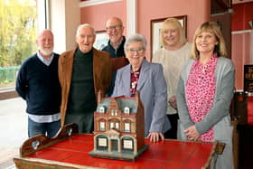 Pictured with the model of the Wigan Little Theatre building: (left to right) archivist Peter Jones, Stan Derbyshire, Gordon Hurst, Chair Anne Woolley, Secretary, Katie Davis, and Sian Anthon