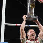 Morgan Smithies of Wigan Warriors lifts the Super League trophy