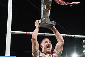 Morgan Smithies of Wigan Warriors lifts the Super League trophy