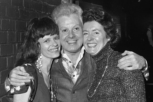 Drag queen Danny La Rue with members of the Post and Chronicle Women's Circle Pauline Richards and Mrs. Ashton after one of his shows at the Golden Garter theatre restaurant, Manchester, in April 1976.