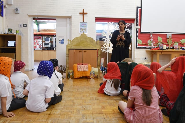 Prags Birk, creative director of Cultural Education-Asians, with pupils at Aspull Church Primary School, to deliver Hinduism and Sikhism interactive workshops, with traditional dancing, dressing up, henna, artwork and a Sikh Gurudwara set up, to every year group in the school.